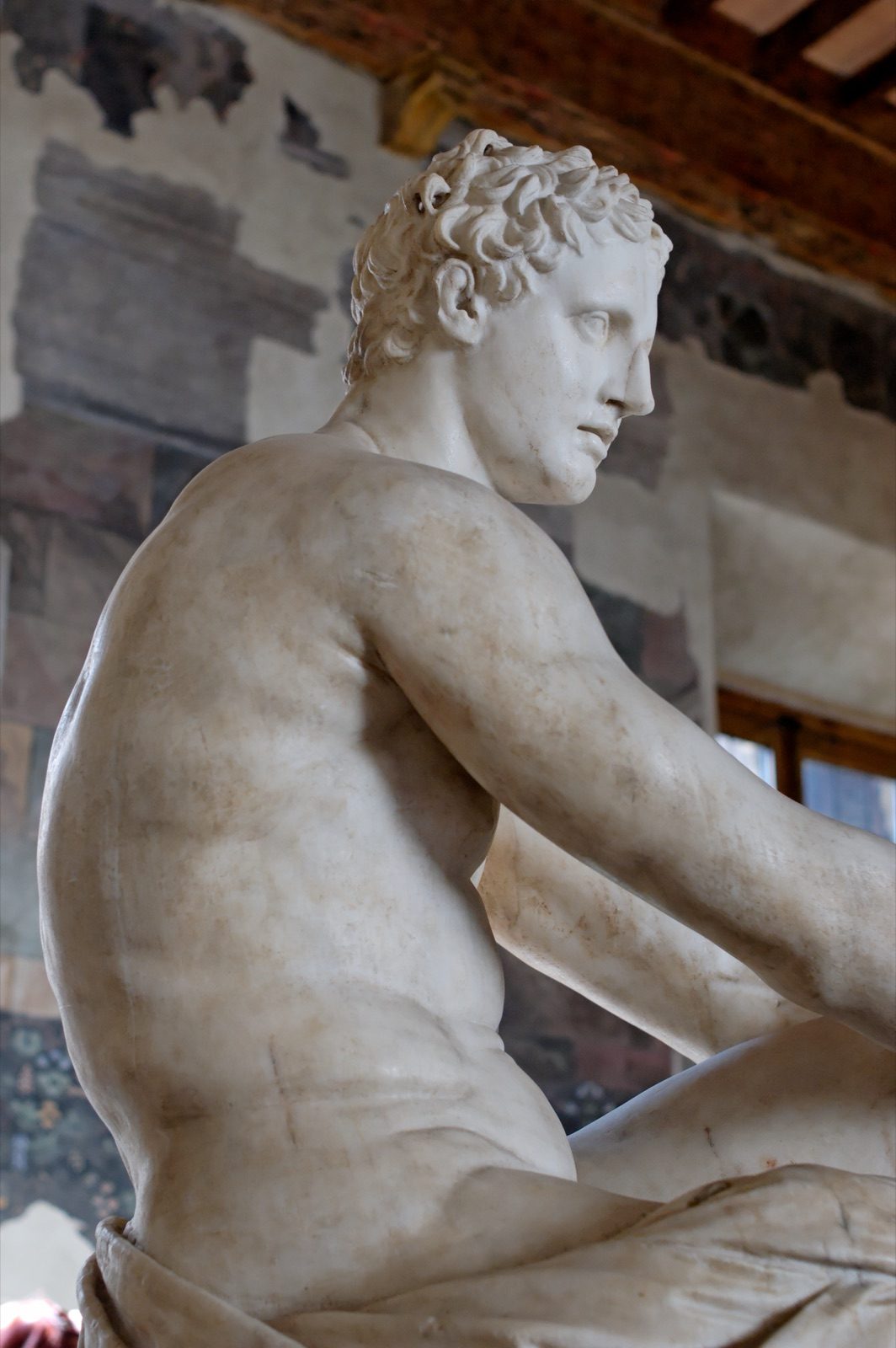 The Ludovisi Ares, a 2nd-century AD Roman marble copy of a late 4th-century BC Greek original, showing the god seated on a trophy of arms with an Eros figure at his feet. On display at Palazzo Altemps, Rome.