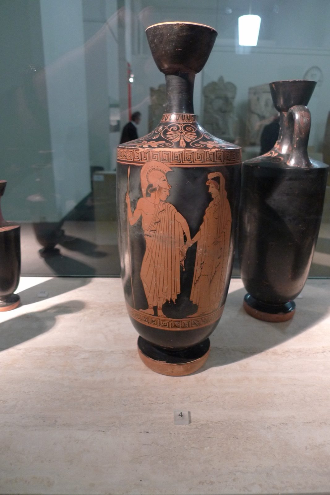 Ancient Greek red-figure pottery depicting Ares in helmet and armor, from the Pergamon Museum in Berlin.