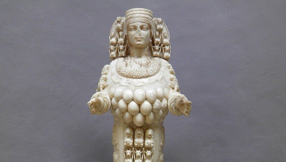 Marble statue of the Ephesian Artemis, 125-175 AD, in the Ephesus Archaeological Museum, showing the goddess's headdress, necklace, and the rows of disputed egg-shaped ornaments covering her lower chest.