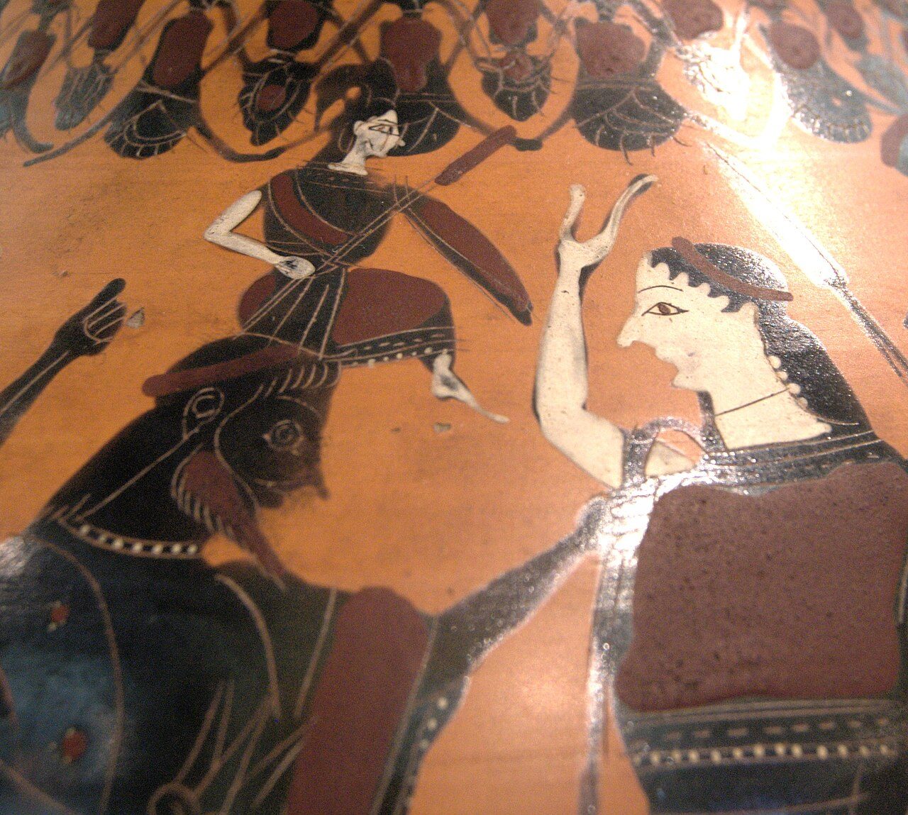 Detail of an Athenian black-figure amphora of about 550-525 BC: a small Athena, already helmeted and holding spear and shield, rises from the head of a seated Zeus while another figure raises a hand beside them. This is a Greek vase-painter's illustration of the myth, not a record of an event.