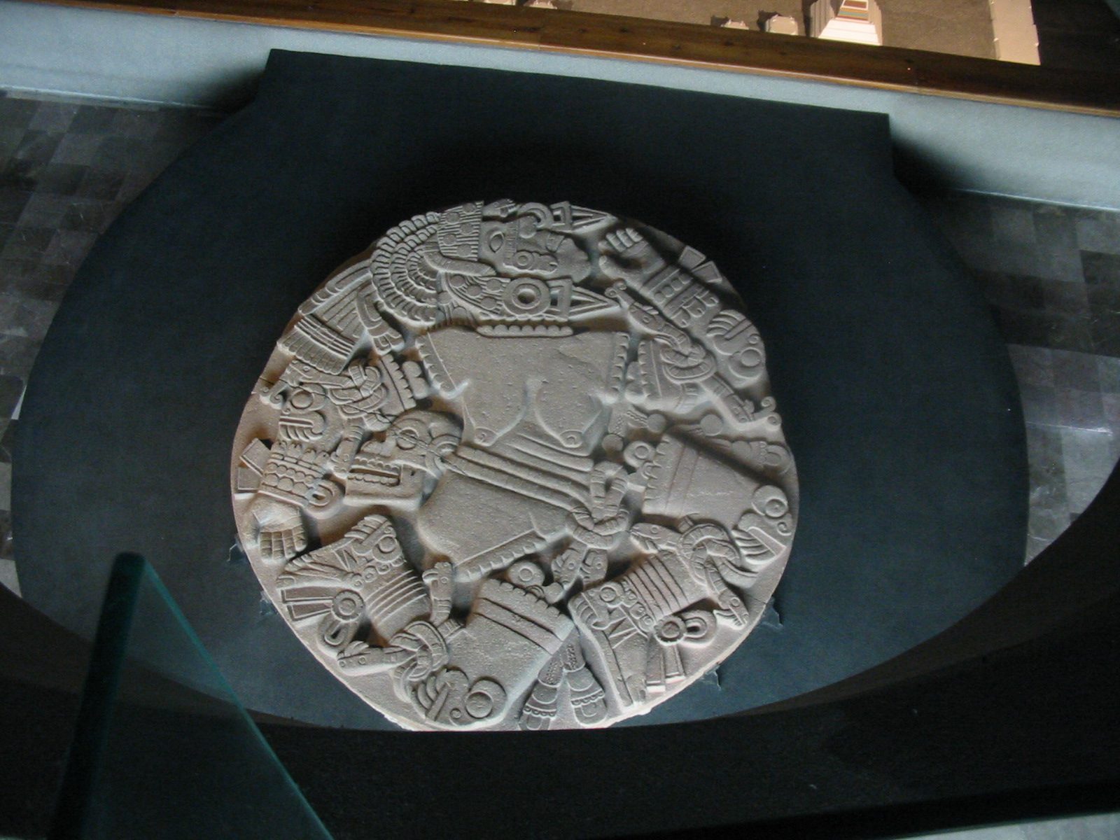The Coyolxauhqui Disk, a large circular stone carved with the dismembered body of the goddess Coyolxauhqui, discovered by utility workers in downtown Mexico City in 1978 and now displayed at the Museo del Templo Mayor.