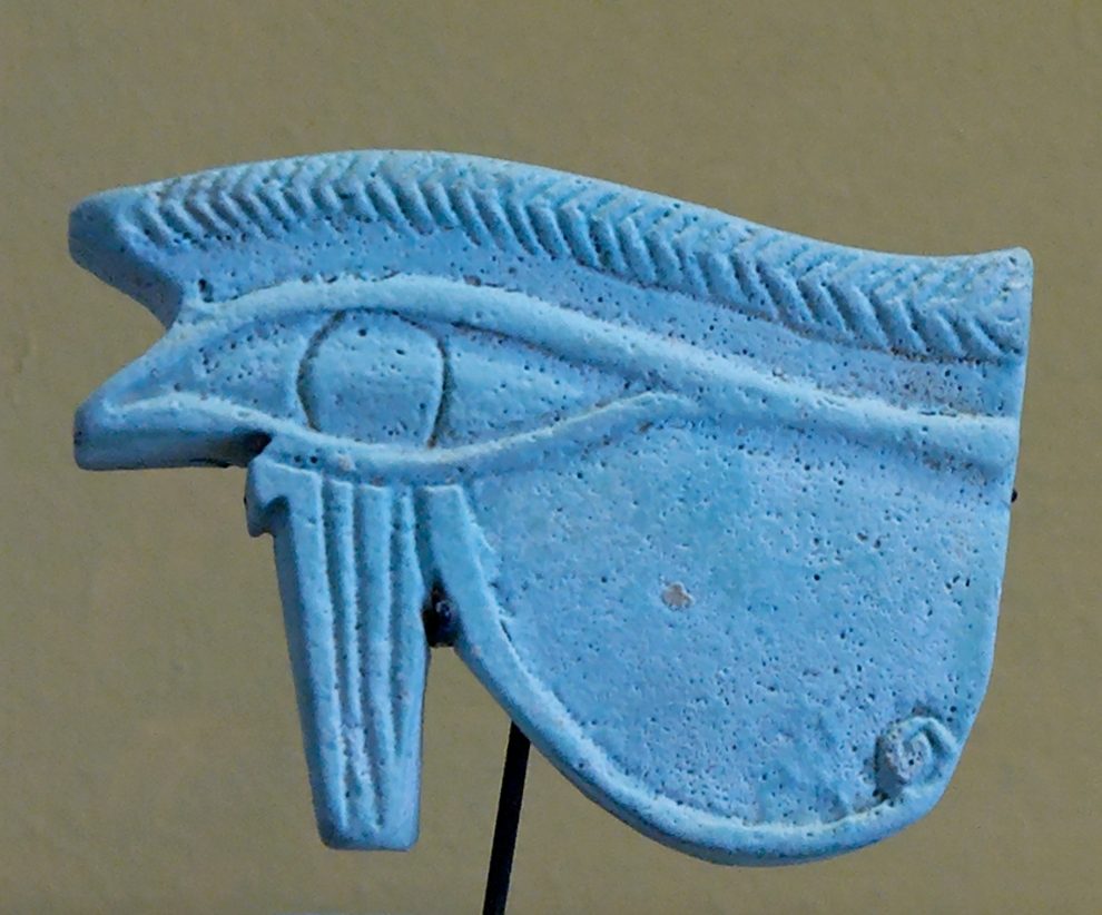 Small earthenware Eye of Horus amulet, Achaemenid-period Egyptian faience, late 6th to 4th century BC, excavated at Susa and now in the Louvre Museum.