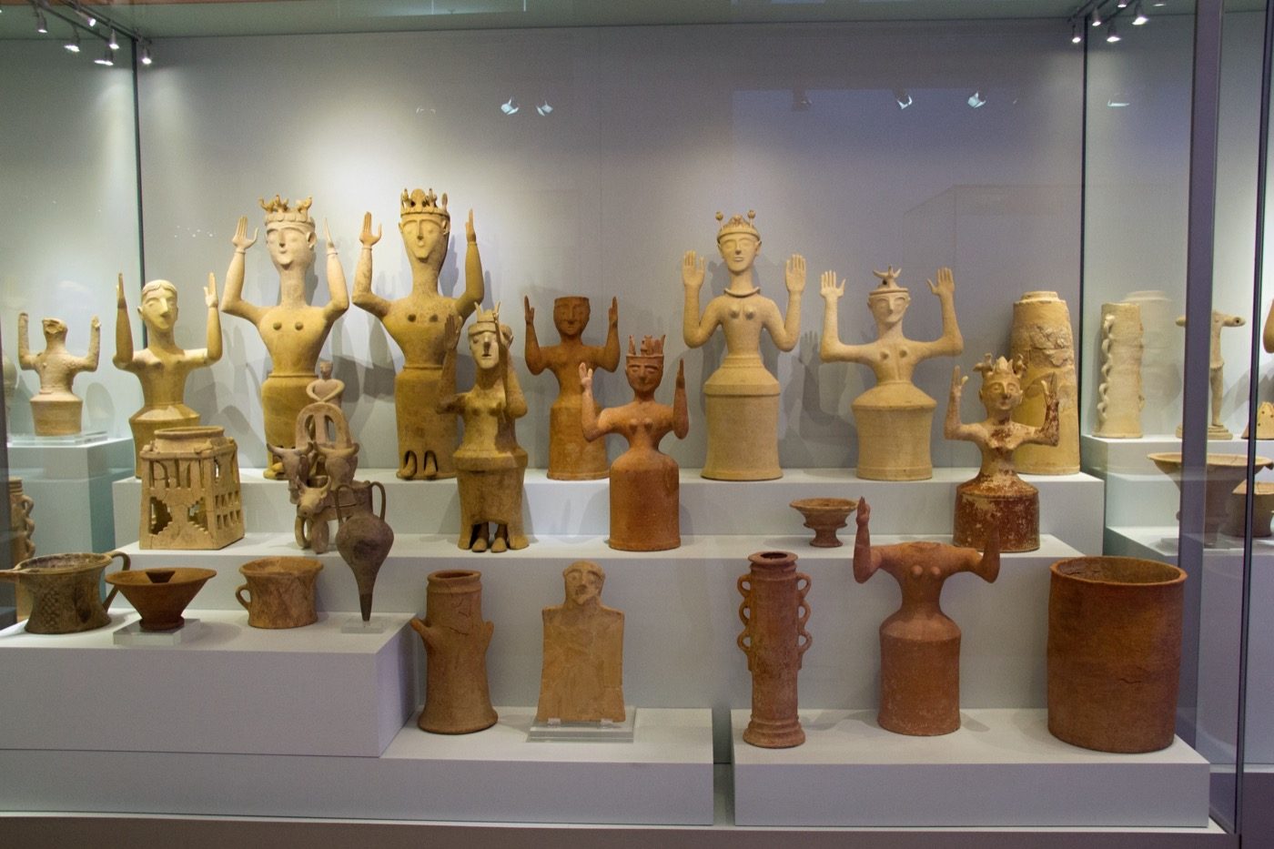 Collection of Minoan terracotta goddess figurines with upraised arms from Gazi, Crete, 1300-1100 BC, now in the Archaeological Museum of Heraklion, including the figure known in modern scholarship as the Poppy Goddess.