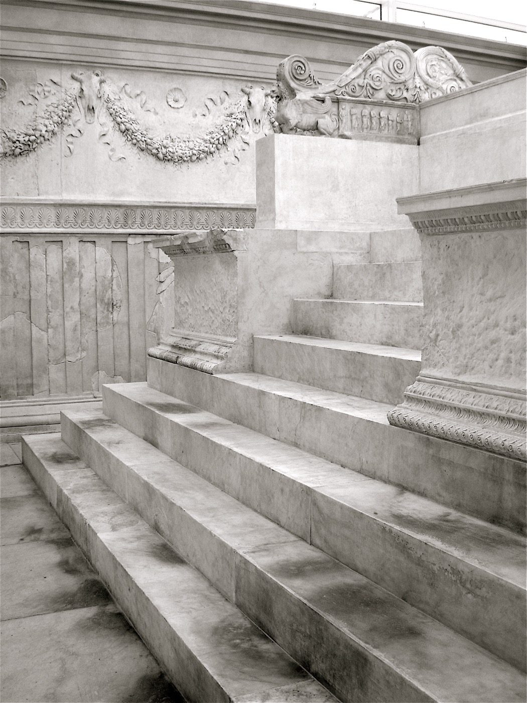 Interior steps and garland relief of the Ara Pacis Augustae in Rome, the altar dedicated to Pax that the Roman Senate commissioned in 13 BC after Augustus's return from Hispania and Gaul.