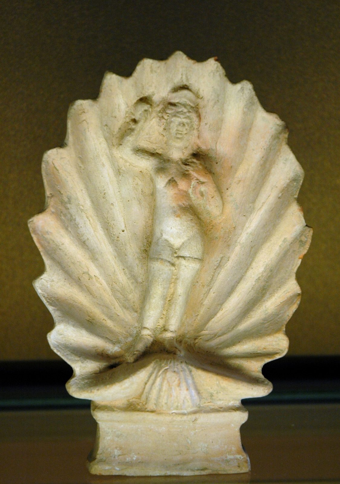 Terracotta figurine of Aphrodite Anadyomene, shown rising from the sea inside a large shell, made in Amisos on the Black Sea coast in the late 1st century BC or early 1st century AD and found at Kertch, Crimea.