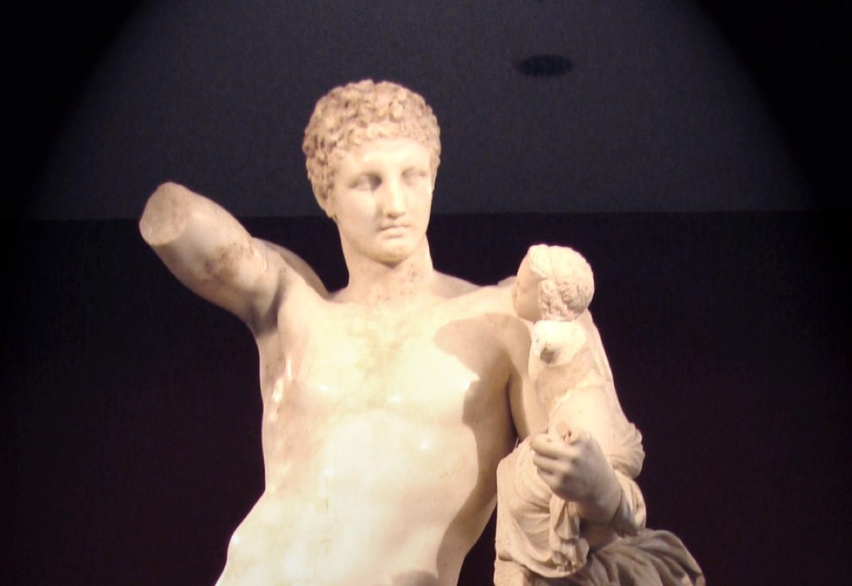 The Hermes of Praxiteles, a marble statue of Hermes carrying the infant Dionysus, discovered in 1877 at the Temple of Hera in Olympia and now in the Archaeological Museum of Olympia.