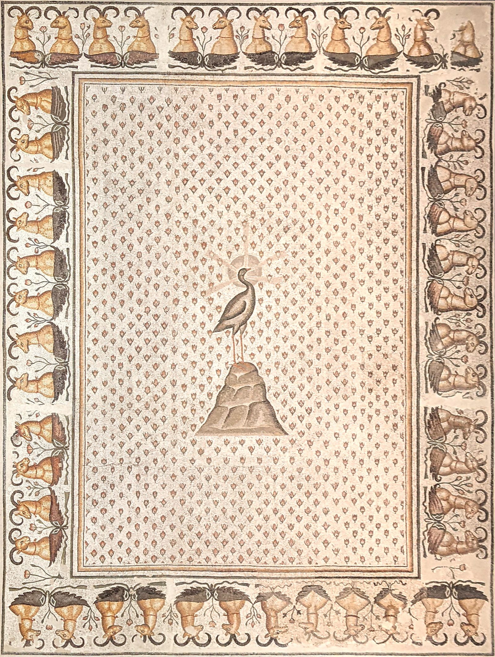 A Late Antique floor mosaic of the phoenix, radiate and haloed, from a villa at Daphne near Antioch, dated to the late 5th century AD and now in the Louvre.
