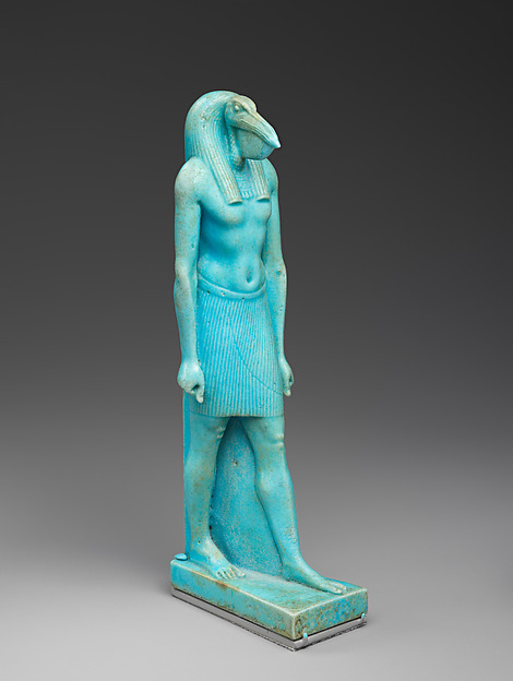 A blue-green faience statuette of the Egyptian god Thoth, shown as a man with an ibis head striding forward in the standard ancient Egyptian pose, from the Ptolemaic Period.