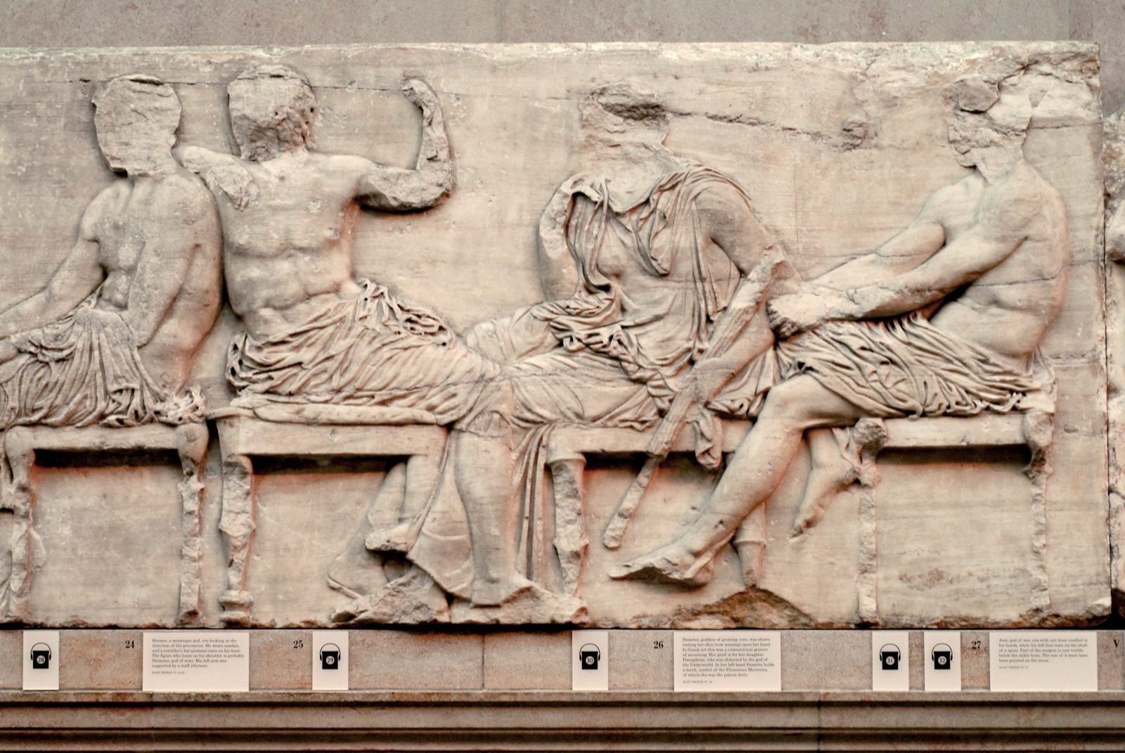 Marble relief fragment from Block IV of the Parthenon's east frieze, showing the seated gods Hermes, Demeter, Ares, and Dionysos, carved under Pheidias's direction between about 447 and 432 BC and now in the British Museum.