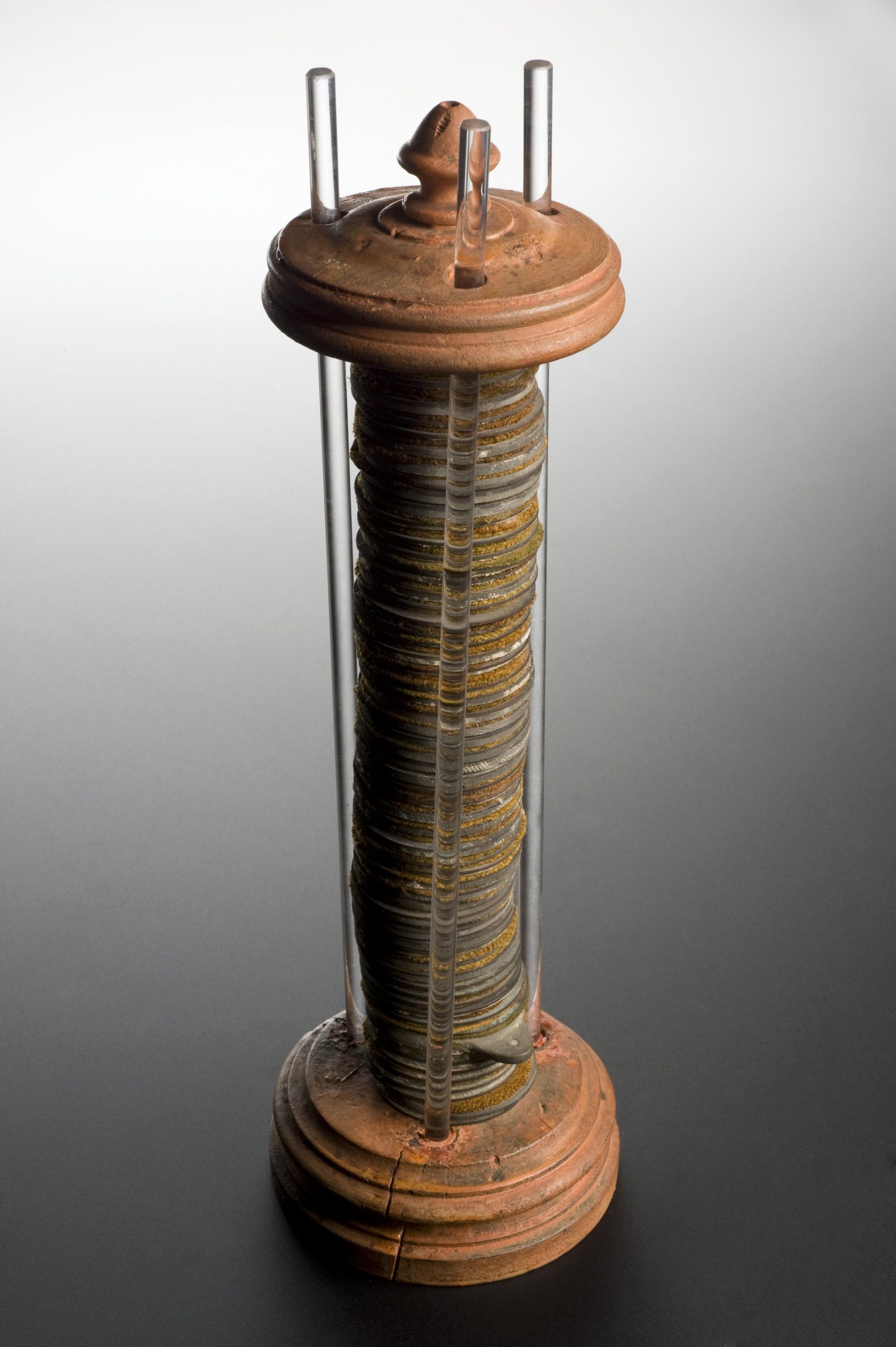 A surviving voltaic pile, made of stacked zinc and copper discs, one of the objects salvaged from a fire at the 1899 Volta Centenary Exhibition in Como, Italy.